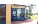 View of the back of a sunroom featuring neutral paint, brick tile and several large windows at 4101 Limerick Dr, Lake Wales, FL 33859