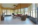 Inviting sunroom with tile floors, neutral walls, ceiling fan, and large windows offering plenty of natural light at 4101 Limerick Dr, Lake Wales, FL 33859