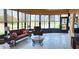 Inviting sunroom with tile floors and large windows offering tranquil views of the surrounding landscape at 4101 Limerick Dr, Lake Wales, FL 33859