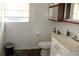 Bathroom with toilet, sink, and vanity at 5031 Timberlane Rd, Lake Wales, FL 33898