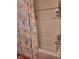 Clean bathroom featuring a bathtub with a decorative shower curtain and tiled walls at 5031 Timberlane Rd, Lake Wales, FL 33898