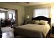 Main bedroom with a full-size bed and en-suite access at 5031 Timberlane Rd, Lake Wales, FL 33898