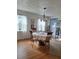 Bright dining room featuring hardwood floors, a chandelier, and natural light from the windows at 5031 Timberlane Rd, Lake Wales, FL 33898