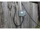 Close up of an electrical box and wiring on a wooden privacy fence at 5031 Timberlane Rd, Lake Wales, FL 33898