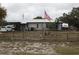 Single story home with American flag at 5031 Timberlane Rd, Lake Wales, FL 33898