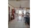 Traditional style kitchen with a ceiling fan and view of a dining table and large windows at 5031 Timberlane Rd, Lake Wales, FL 33898