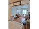 Comfortable living room area with hardwood floors adjacent to the kitchen at 5031 Timberlane Rd, Lake Wales, FL 33898