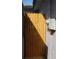 Side yard featuring a wooden gate for privacy to access the backyard at 5031 Timberlane Rd, Lake Wales, FL 33898