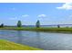 Beautiful lakefront property featuring a grassy lawn and water access at 802 Magnolia Pl, Winter Haven, FL 33884