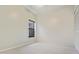 Neutral bedroom featuring a window, closet and neutral carpet flooring at 802 Magnolia Pl, Winter Haven, FL 33884