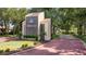 Welcoming entrance to Winterset community with landscaped grounds at 802 Magnolia Pl, Winter Haven, FL 33884