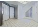 Bright kitchen area with white cabinets, stainless steel appliances, and tile flooring at 802 Magnolia Pl, Winter Haven, FL 33884