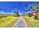 Long driveway leading to property at 8053 & 8051 Lake Lowery Rd, Haines City, FL 33844