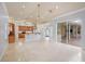 Spacious kitchen featuring wood cabinets and an island at 104 Van Fleet Ct, Auburndale, FL 33823