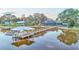 Scenic view of a house with a long wooden dock that leads to a covered boat lift on the water at 1769 S Lake Reedy Blvd, Frostproof, FL 33843
