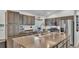 Spacious kitchen with stainless steel appliances, a large island, and ample cabinet storage at 1769 S Lake Reedy Blvd, Frostproof, FL 33843