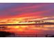 Water view showcasing a vibrant sunset with colorful reflections and peaceful scenery at 1769 S Lake Reedy Blvd, Frostproof, FL 33843