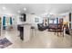 Bright living room featuring tile floors, comfortable seating, and an open layout at 1924 Amber Sweet Cir, Dundee, FL 33838