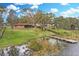 Aerial view showing house, dock, and lake access at 196 Paradise Island Dr, Haines City, FL 33844