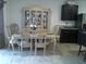 Bright dining room features a classic dining set and built-in hutch at 3329 Lounging Wren Ln, Bartow, FL 33830