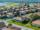 Single-story home nestled in a community, aerial view at 4076 Tralee Dr, Lake Wales, FL 33859