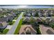 Single story house near a lake, aerial view at 4076 Tralee Dr, Lake Wales, FL 33859