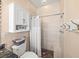 Clean bathroom with shower stall, toilet and cabinet at 4076 Tralee Dr, Lake Wales, FL 33859