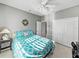 Bright bedroom with a queen-size bed and double doors at 4076 Tralee Dr, Lake Wales, FL 33859