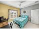 Bedroom with a bed, desk, and window with view of the backyard at 4076 Tralee Dr, Lake Wales, FL 33859