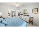 Bedroom with large bed, dresser, and view into bathroom at 4076 Tralee Dr, Lake Wales, FL 33859