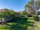 Backyard view with palm trees and manicured lawn at 4076 Tralee Dr, Lake Wales, FL 33859