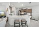 Modern kitchen with an L-shaped island and stainless steel appliances at 4076 Tralee Dr, Lake Wales, FL 33859