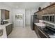 Modern kitchen with stainless steel appliances and ample cabinetry at 4076 Tralee Dr, Lake Wales, FL 33859