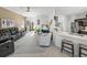 Open living area with a view of the kitchen and access to the back lanai at 4076 Tralee Dr, Lake Wales, FL 33859