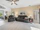 Relaxing living room featuring comfortable seating and access to the lanai at 4076 Tralee Dr, Lake Wales, FL 33859