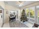 Sunroom with Christmas tree, seating, and view of backyard at 4076 Tralee Dr, Lake Wales, FL 33859