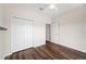 Bedroom with double doors and wood flooring at 4151 Muirfield Loop, Lake Wales, FL 33859