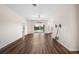 Living room with hardwood floors, pool view, and sliding doors at 4151 Muirfield Loop, Lake Wales, FL 33859