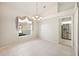 Bright dining room with tiled floors and a view to the kitchen at 4340 Winding Oaks Cir, Mulberry, FL 33860