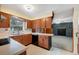 Kitchen with brown cabinets and appliances at 4737 Pocahontas Ln, Lakeland, FL 33810