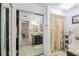 Bathroom with shower/tub combo, vanity, and mirrored closet at 6102 N Fork Ct, Lakeland, FL 33809