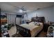 Primary bedroom with crib and ceiling fan at 6102 N Fork Ct, Lakeland, FL 33809