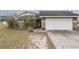 Brick house with attached garage and landscaping at 6102 N Fork Ct, Lakeland, FL 33809