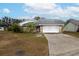Brick house with attached garage and a large yard at 6102 N Fork Ct, Lakeland, FL 33809