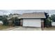 Brick house with attached garage, driveway, and landscaping at 6102 N Fork Ct, Lakeland, FL 33809