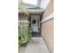 Front entry with brick facade and potted plants at 6102 N Fork Ct, Lakeland, FL 33809