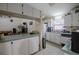 Open kitchen features a breakfast bar and view to living room at 6102 N Fork Ct, Lakeland, FL 33809