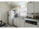 Bright kitchen with white cabinets and green countertops at 6102 N Fork Ct, Lakeland, FL 33809