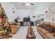 Spacious living room with two sofas and a Christmas tree at 6102 N Fork Ct, Lakeland, FL 33809