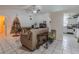 Living room with tile floor and view of kitchen at 6102 N Fork Ct, Lakeland, FL 33809